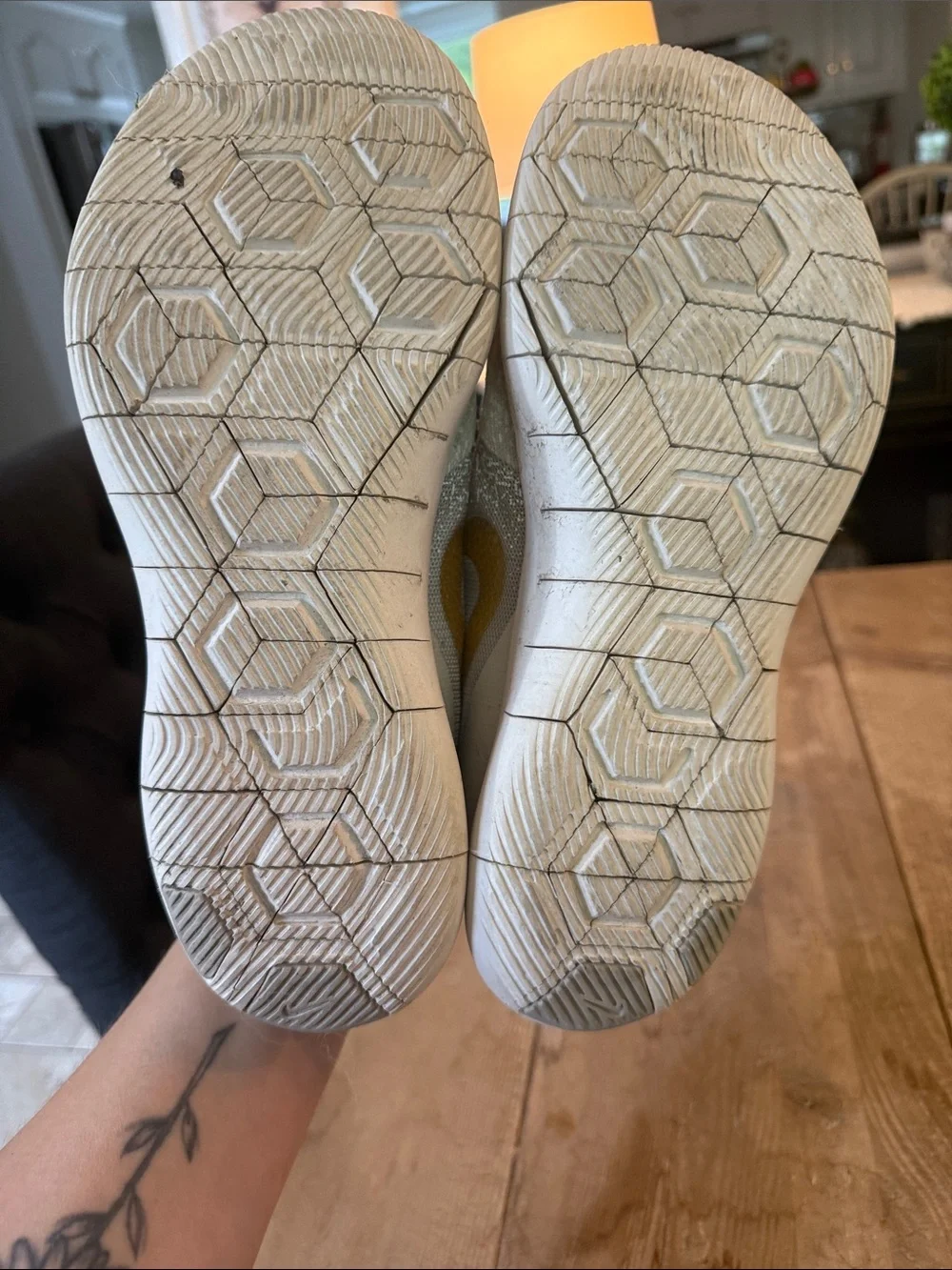 Nike Women's Light Gray Sneakers with Gold Swoosh